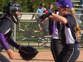 Western catcher Jenn Wakefield prepares to hoist Mustangs pitcher Stacie Cox after they won the Canadian Collegiate Softball Association championship with an 8-3 victory over Ottawa at Stronach Park on Monday. (Mike Hensen, London Free Press)