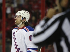 New York Rangers left wing Rick Nash (61) looks up at the scoreboard during a break in the action against the Washington Capitals in the second period of Game 1 of their NHL Eastern Conference quarterfinals hockey playoff series in Washington, May 2, 2013. (REUTERS/Jonathan Ernst)