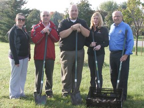 The Rotary Club of Chatham Sunrise has partnered with Mainstreet Credit Union to plant about 10,000 daffodil bulbs in Chatham this fall, including some at the intersection of Bloomfield Road and Park Avenue West where volunteers planted some bulbs on Oct. 15. From left are Chelsey Preston, Bruce Ross, Shawn Bustin and Kathy Therrien of Mainstreet and John Lawrence, president of Rotary Sunrise.
