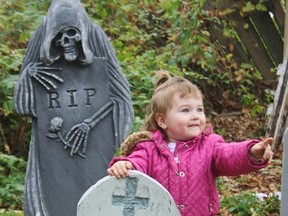 Madison, 2, has fun at one of the displays in the Halloween-themed Reaper's Realm near Sombra. HEATHER YOUNG/ SARNIA THIS WEEK/ QMI AGENCY