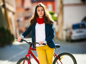 Getting around on a bicycle instead of in a car is one way to both save money and help the environment.