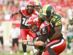 Rennie Curran, shown here taking down Stampeders QB Bo Levi Mitchell during he Labour Day Classic, was named the league's defensive player of the week. (QMI Agency)