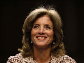 Caroline Kennedy, daughter of former U.S. President John F. Kennedy, smiles as she testifies at her U.S. Senate Foreign Relations Committee hearing on her nomination as the U.S. Ambassador to Japan, on Capitol Hill in Washington, September 19, 2013. (REUTERS/Jason Reed)