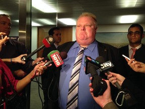 Toronto Mayor Rob Ford speaks to reporters at Toronto City Hall on Oct. 16, 2013. (Don Peat/QMI Agency)