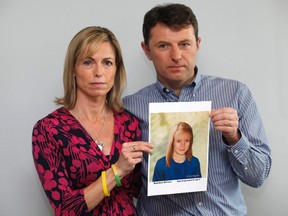Kate and Gerry McCann pose with a computer generated image of how their missing daughter Madeleine might look now, during a news conference in London on May 2, 2012. (REUTERS/Andrew Winning)