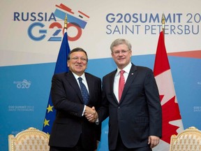 European Commission President Jose Manuel Barroso (L) and Prime Minister Stephen Harper shake hands as they meet on the sidelines of the G20 summit in St. Petersburg September 6, 2013. REUTERS/Virginia Mayo/Pool