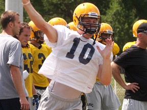 Queen's quarterback Billy McPhee, throwing a pass during training camp in August, and the Golden Gaels host the Guelph Gryphons Saturday at Richardson Stadium. A victory would clinch second place for the Gaels and give them a first-round bye in the conference playoffs. (Ian MacAlpine/The Whig-Standard)
