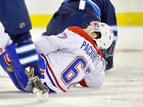 Montreal Canadiens forward Max Pacioretty is injured during the first period against the Winnipeg Jets at MTS Centre. (Bruce Fedyck/USA TODAY Sports)