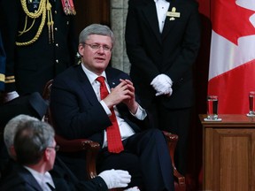 Prime Minister Stephen Harper waits for the start of the Speech from the Throne in the Senate chamber on Wednesday. Earlier Harper said that he would not be attending the next Commonwealth Heads of Government Meeting (CHOGM) which is to be held in Sri Lanka.
 REUTERS/QMI Agency