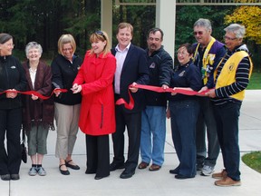 St. Thomas Mayor Heather Jackson, sixth from right, cuts the ribbon at the new Lions Club Celebration Pavilion in Pinafore Park on Friday. The pavilion will be rented to people celebrating weddings, baby showers and similar events. Ben Forrest/Times-Journal