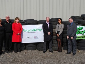 Auto Guys owners Lynda Groom, left, and Bob Ward stand with St. Thomas Mayor Heather Jackson, Andrew Horsman of Ontario Tire Stewardship, Gina Banwait of CAA and principal Jim Bowden of Elgin Court Public School on Friday, Oct. 18, 2013. Auto Guys is participating in the Recycle Drive tire recycling program this month and hopes to donate a $20,000 re-greening package to Elgin Court. Ben Forrest/QMI Agency/Times-Journal