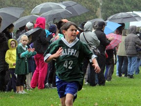 JJ Fogarty of Gregory Hogan sprints to the finish line to win the junior boys race at the annual St. Clair Catholic District School Board cross country meet on Saturday, Oct. 19. The meet featured over 300 students competing in six races. SHAUN BISSON/THE OBSERVER/QMI AGENCY