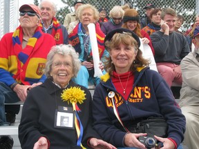 Katherine Ferguson, class of Arts '39, and daughter Leslie Smith, who graduated from Queen's University in 1969, take in the Homecoming football game Saturday at Richardson Stadium. (PETER HENDRA The Whig-Standard)