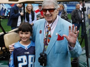 A young Tennessee Titans' fan meets Tennessee Titans' owner Bud Adams before their NFL football game against the Houston Texans  in Nashville, Tennessee December 2, 2012. (REUTERS/Harrison McClary)