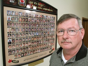 Gord Rittwage, president of the Collins Bay branch of the Royal Canadian Legion, stands in front of a memorial to the Canadians killed in Afghanistan. The branch will be re-named after one of them, Capt. Matthew Dawe. (Michael Lea The Whig-Standard)