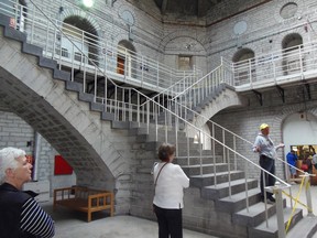 A tour guide speaks to visitors to Kingston Penitentiary during the recent tours. Seen in the background are the elegant, free-standing stone steps curving to upper levels, a Piranesi architectural feature borrowed by architect William Coverdale.
Floyd Patterson