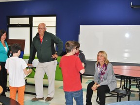 Trevor Thain and Maryann Chichak talk to St. Joseph Grade 6 students after a debate between the two mayoral candidates on Tuesday, Oct. 15.
Grade six teacher Gail Prince organized the debate as part of the Grade 6 social studies unit on Canadian government.
Barry Kerton | Whitecourt Star