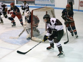 Patrick MacDougall of the Burns Demeyere AE bantams takes the puck to the Glandbrook net, backhanding a pass through the crease to Curtis Collver on the far side. Collver converted MacDougall's pass for the 2-1 game-winning goal Sunday.