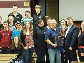 Surrounded by students, longtime North Lambton Secondary School teacher and coach Cathy Johnson accepts the Warden's Citizen of the Month award from Todd Case for October.
SUBMITTED PHOTO