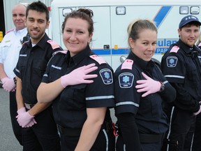 Raising breast cancer awareness, Hastings-Quinte EMS paramedics are wearing pink shoulder badges and gloves during October. From left are superintendent Brent Neal and paramedics Efram Ellenbogen, Claudia Cicciarella, Sherri Deslippe, Shawn Foster and Amanda Varner.