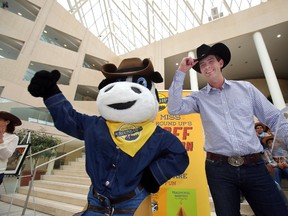 Don Iveson poses fro pictures after getting a black cowboy hat from River City Mascot T-Bone.  Mayor elect Don Iveson hosted his first event as mayor for River City Roundup at city hall in Edmonton. Alberta on Oct 23, 2013.  PERRY MAH/Edmonton Sun/QMI Agency