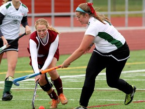 Regiopolis-Notre Dame Panthers’ Hannah Kinstler, left, and Holy Cross Crusaders’ Kate Schenk battle for the ball during high school girls field hockey semifinal action at CaraCo Home Field on Wednesday. Regi scored twice in the second half to win the game 2-1 and will meet the Sydenham Golden Eagles in the championship game Friday at 3 p.m. at CaraCo Home Field. Sydenham shut out the Kingston Blues 3-0 in the other semifinal game Wednesday.