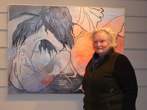 Gunhild Hotte's exhibit "Enduring Nature/ A Tribute to Kika" is currently being displayed at the Cochrane Public Library's gallergy. This painting behind Hotte was particularly loved by Quiteria (Kika) Paiva.