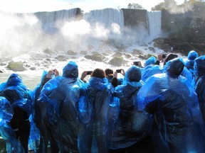 Passengers enjoy the final day of operation on the Canadian side for the Maid of the Mist Thursday. After 167 years, the iconic tourist attraction will be replaced by California-based Hornblower next spring. PHOTO: John Law / Niagara Falls Review