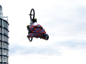 Adrian Bittern flips upside down while practicing his biking at the KMTS Skate Park in Kenora. Bittern just started competing in BMX events and is now sponsored by Vanz.
GRACE PROTOPAPAS/Daily Miner and News