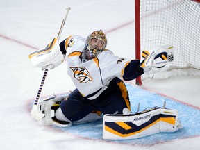 Nashville Predators goalie Pekka Rinne makes a glove save against the Montreal Canadiens during NHL play at the Bell Centre. (ERIC BOLTE/USA TODAY Sports)