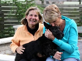 Scottish terrier Bella is the puppy mill survivor that inspired Pam Chin (right) to start researching and investigating dog breeding over the past three years. Chin started a Facebook page, "Kijiji Stop Selling Puppies," that now has almost 4,000 likes, including the support from activist Georgette Parsons (left). MELANIE ANDERSON/THE OBSERVER/QMI AGENCY