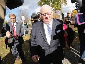 Prince Edward Island Senator Mike Duffy arrives on Parliament Hill in Ottawa October 22, 2013. (REUTERS/Chris Wattie)