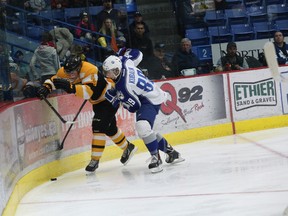 Mike Moffat of the Kingston Frontenacs and Dominik Kubalik of the Sudbury Wolves battle for possession of the puck during Ontario Hockey League action at the Sudbury Community Arena on Friday. (John Lappa/QMI Agency)