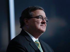 Finance Minister Jim Flaherty listens to a question during a news conference in Ottawa Oct. 28, 2013. REUTERS/Chris Wattie