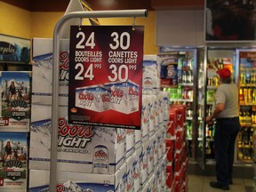 Shoppers check out the selection of beer at a corner store in Gatineau, Que. (QMI AGENCY PHOTO)