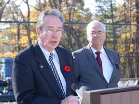 Ontario Rural Affairs Minister Jeff Leal (left) at a sewer project  with Kingston and the Islands MPP and Attorney General John Gerretsen after announcing funding for the project. (Ian MacAlpine The Whig-Standard)