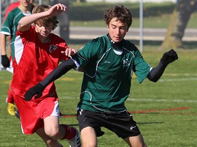 NCC (green shirts) and SPSS battle it out for Bay of Quinte junior boys soccer supremacy, Monday at MAS II. (Paul Svoboda/The Intelligencer)