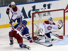 Montreal Canadiens goalie Peter Budaj (30) makes a save in front of New York Rangers center Derek Stepan (21) during the second period of a game at Madison Square Garden. (Brad Penner-USA TODAY Sports)