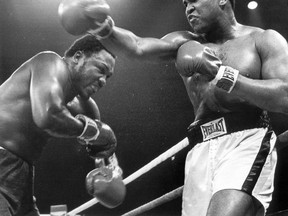 Muhammad Ali fighting Joe Frazier on Oct. 1, 1975. Ali won with a TKO in the 14th round. (File photo)