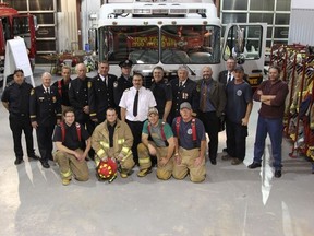 Cochrane's firefighters and municipal representatives gathered for a photo in front of the new 2011 Carl Thibault rescue/pumper truck at the Fire Prevention Week Open House on October 9.