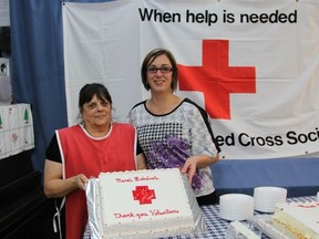 Betty Beadman, Red Cross volunteer, and Melissa Foy, Home Support Coordinator for the Red Cross, cut the volunteer appreciation cakes. This was Foy's first Volunteer Appreciation Dinner as the Red Cross' Home Support Coordinator.