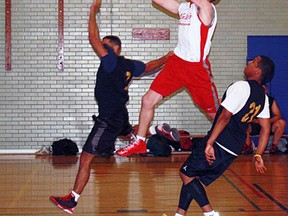 Ben Earhart, of Waite’s Printing, flies to the hoop in St. Thomas Men's Basketball League opening-night action. Contributed