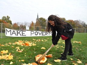 Western University student Michala Abramovitch breaks a pumpkin during the annual Engineers Without Borders Pumpkin Drop Oct. 30, 2013. CHRIS MONTANINI\LONDONER\QMI AGENCY