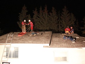 Firefighter teams organized two different ways to get an injured person safely off a roof during Tuesday, Oct 22’s evening practice using ropes, strechers, ladders and ingenuity.