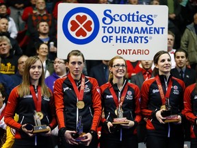 Team Ontario curlers, from left, skip Rachel Homan, Emma Miskew, Alison Kreviazuk and Lisa Weagle stand with their medals and trophies after defeating Manitoba to win the Scotties Tournament of Hearts championship game at the Rogers K-Rock Centre on Feb. 24. (Mark Blinch/Reuters)
