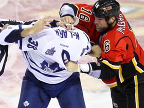 Frazer McLaren of the Leafs and Brian McGrattan of the Calgary Flames were involved in a first-period fight last night. McLaren finished the evening with a scratched eyeball. (DARREN MAKOWICHUK/QMI Agency)