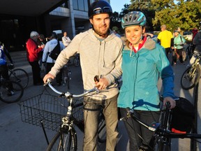 Daniel Hall, 27 and Jess Hall, 26, prepare to ride with a group of local cyclists at city hall Oct. 30, 2013 in London. Ont. The pair was among roughly 40 cyclists who gathered in support of Tyler Brooks-Szabo, the 10-year-old boy who was struck by a car while riding his bike on the sidewalk of Wexford Ave. Oct. 25. CHRIS MONTANINI\LONDONER\QMI AGENCY