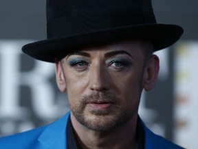 British singer-songwriter Boy George poses on the red carpet arriving at the BRIT Awards 2013 in London on February 20, 2013.  AFP PHOTO / ANDREW COWIE