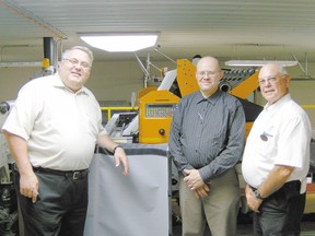 Elgin-Middlesex-London MP Joe Preston, left, Enns Textile president Francisco Enns and then Malahide Mayor John Wilson in this 2010 file photo.