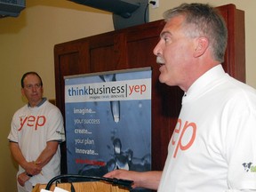 John Regan, left, general manager of the Elgin Business Resource Centre in St. Thomas listens as Steve Peters, then Liberal MPP for Elgin-Middlesex-London, announces $57,680 in funding for the Youth Entrepreneurship (YEP) program during its launch at the EBRC in June, 2011.